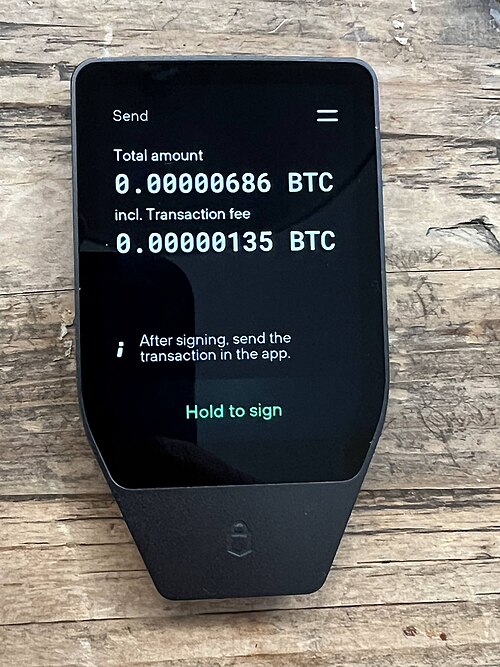 Hardware wallet displaying a cryptocurrency transaction for long-term self-custody storage.
